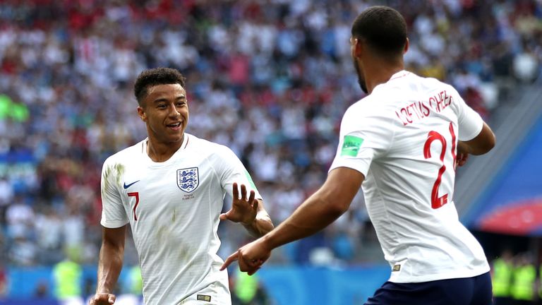 Jesse Lingard celebrates after scoring England's third