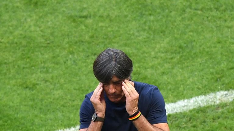 Joachim Loew rubs his head during the 2-0 defeat to South Korea