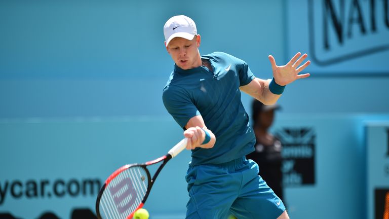 Britain's Kyle Edmund returns to Australia's Nick Kyrgios during their men's singles second-round match at the ATP Queen's Club Championships tennis tournament in west London on June 21, 2018. 