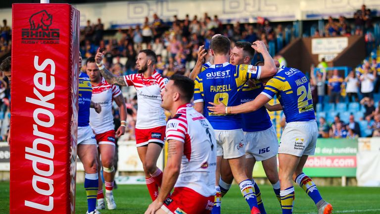 Jack Walker of Leeds celebrates his try with team-mates