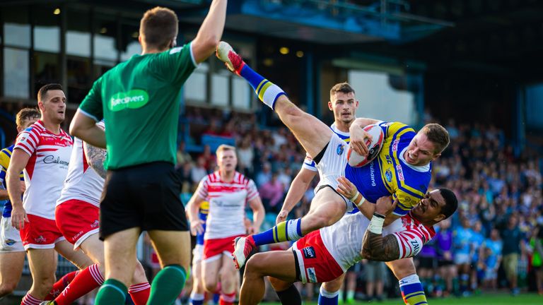 Peter Mata'utia was shown a red card for this dangerous tackle on Leeds' Matt Parcell