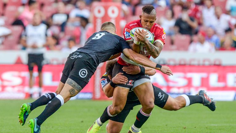 The Lions' Elton Jantjies is shackled by the Sharks' defence during their clash in February