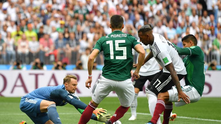 Manuel Neuer makes a save from Hugo Ayala 