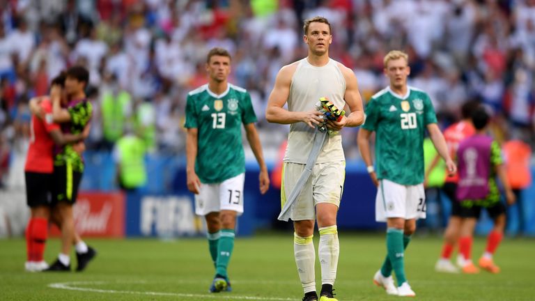 Manuel Neuer,  Thomas Mueller and Julian Brandt leaves the pitch following Germany's elimination from the 2018 World Cup