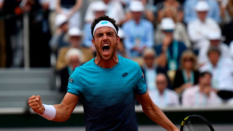 Italy's Marco Cecchinato celebrates after a point against Serbia's Novak Djokovic during their men's singles quarter-final match on day ten of The Roland Garros 2018 French Open tennis tournament in Paris on June 5, 2018.