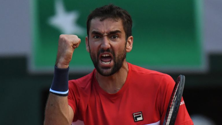 Croatia's Marin Cilic celebrates after victory during his men's singles fourth round match against Italy's Fabio Fognini on day nine of The Roland Garros 2018 French Open tennis tournament in Paris on June 4, 2018. 