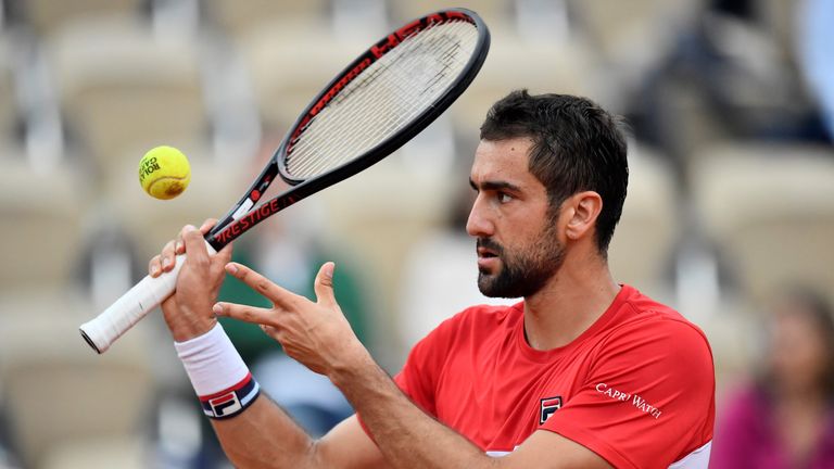 Croatia's Marin Cilic hits a ball back to Argentina's Juan Martin del Potro after a point during their men's singles quarter-final match on day eleven of The Roland Garros 2018 French Open tennis tournament in Paris on June 6, 2018.