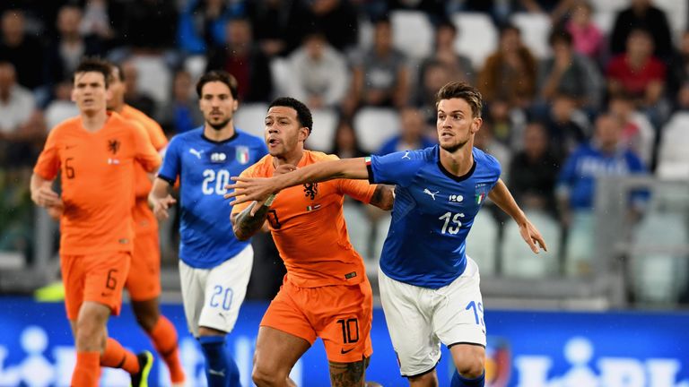 Memphis Depay and Daniele Rugani during Italy v the Netherlands