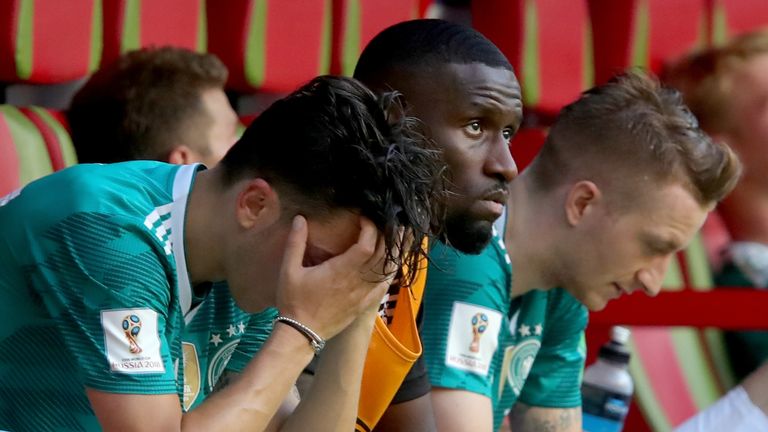 Mesut Ozil, Antonio Rudiger and Marco Reus sit dejected on the Germany bench following their 2-0 loss to South Korea