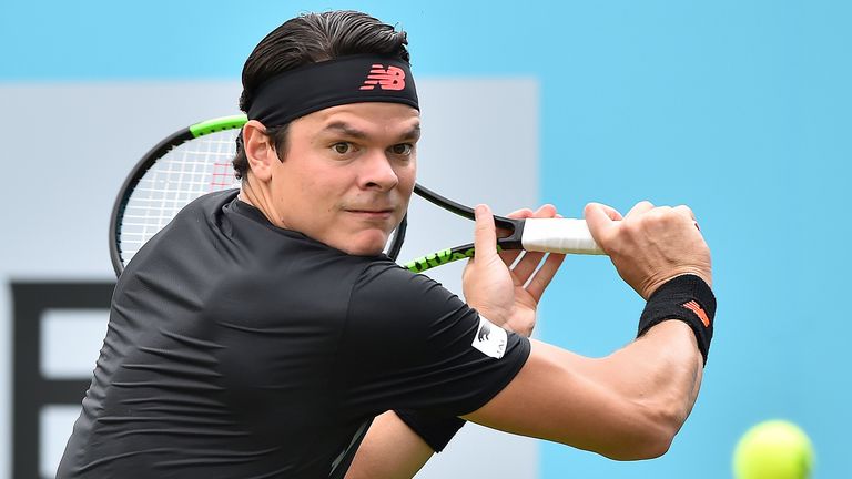 Canada's Milos Raonic returns to India's Yuki Bhambri during their first round men's singles match at the ATP Queen's Club Championships tennis tournament in west London on June 19, 2018.
