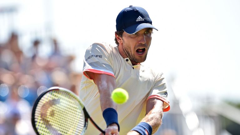 Germany's Mischa Zverev returns to Slovakia's Lukas Lacko during their men's singles finals match at the ATP Nature Valley International tennis tournament in Eastbourne, southern England on June 30, 2018.