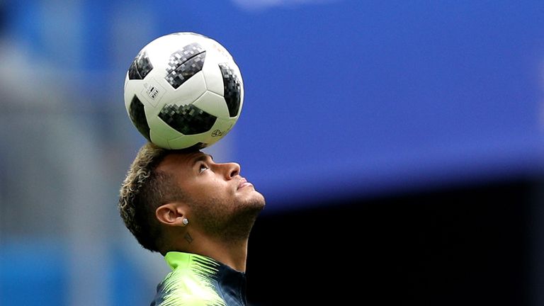 Neymar warms up prior to the group E match between Brazil and Costa Rica