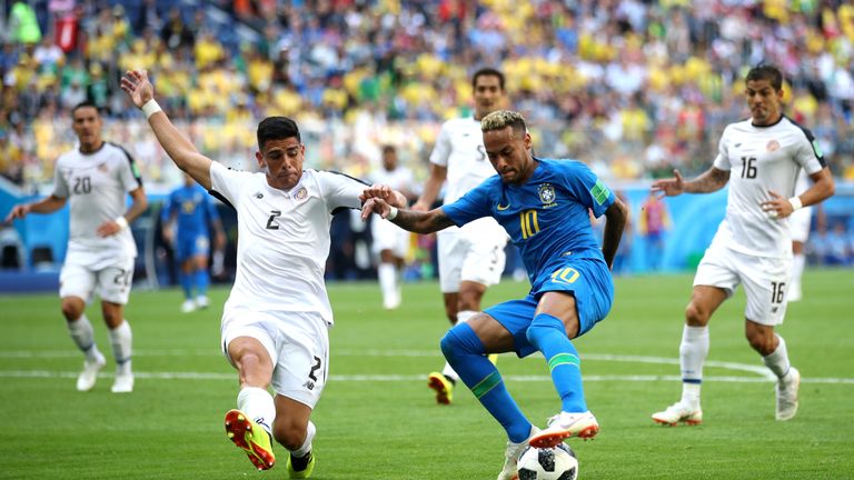 Neymar takes on Johnny Acosta during the group E match  in Saint Petersburg