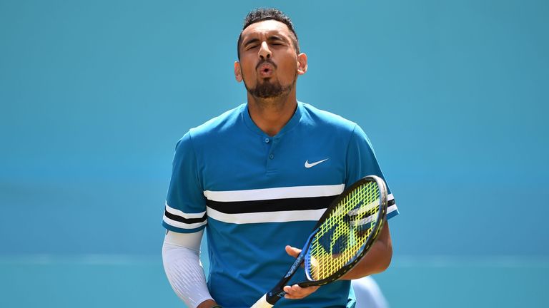 Australia's Nick Kyrgios reacts to Britain's Kyle Edmund during their men's singles second-round match at the ATP Queen's Club Championships tennis tournament in west London on June 21, 2018.