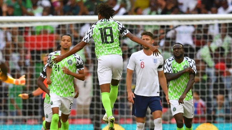 Nigeria midfielder Alex Iwobi (C) celebrates after scoring against England at Wembley 