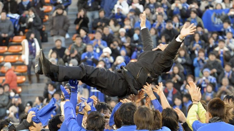 Gamba Osaka head coach Akira Nishino is tossed into the air to celebrate the team's victory in the Emperor's Cup final against Kashiwa Reysol in Tokyo on January 1, 2009