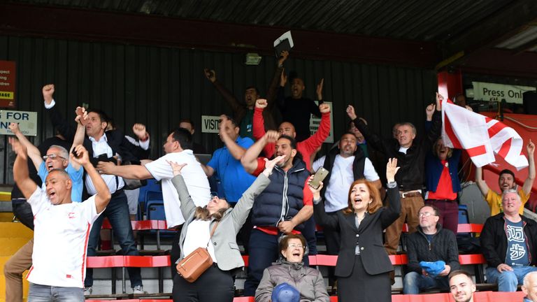 Supporters celebrate in the stands as Northern Cyprus play out a 3-2 victory in the Confederation of Independent Football Association (CONIFA)'s 2018 World Football Cup semi-final match between Northern Cyprus and Padania at Colston Avenue Football Stadium in Carshalton, north London, on June 7, 2018.