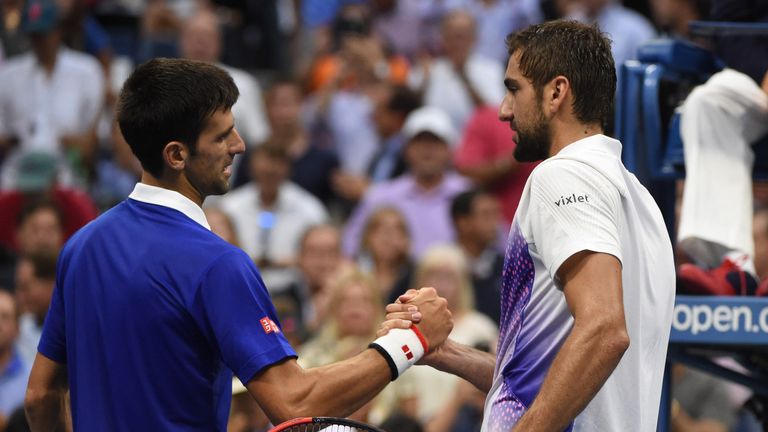 Novak Djokovic of Serbia shakes hands after beating Marin Cilic of Croatia during their 2015 US Open Men's Singles semifinals at the USTA Billie Jean King National Tennis Center on September 11, 2015 in New York. 