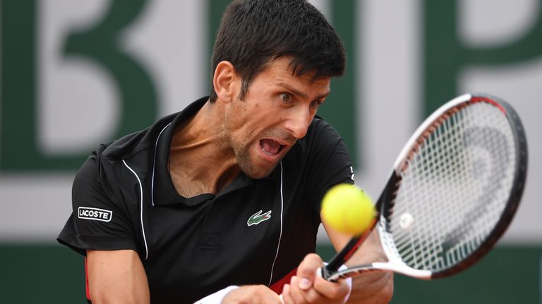 Serbia's Novak Djokovic returns the ball to Italy's Marco Cecchinato during their men's singles quarter-final match on day ten of The Roland Garros 2018 French Open tennis tournament in Paris on June 5, 2018.