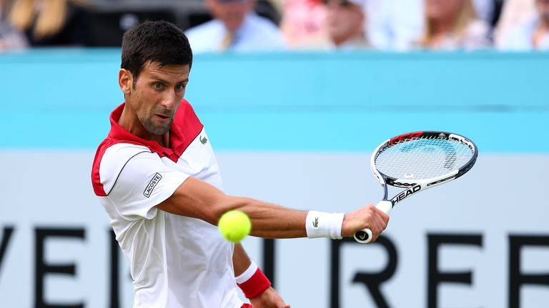 Novak Djokovic of Serbia plays a backhand during his match against John Millman of Australia on Day Two of the Fever-Tree Championships at Queens Club on June 19, 2018 in London, United Kingdom