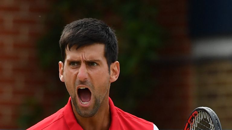 Serbia's Novak Djokovic reacts to France's Jeremy Chardy during their men's singles semi-finals match at the ATP Queen's Club Championships tennis tournament in west London on June 23, 2018. - Serbia's Novak Djokovic beat France's Jeremy Chardy 7-6 (7/5), 6-4. 