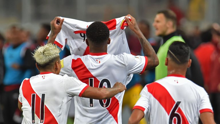 Peru's Raul Ruidiaz, Jefferson Farfan and Miguel Trauco show a number nine jersey in support of their suspended teammate Paolo Guerrero, during their 2018 World Cup qualifying play-off second leg football match against New Zealand in Lima, Peru, on November 15, 2017