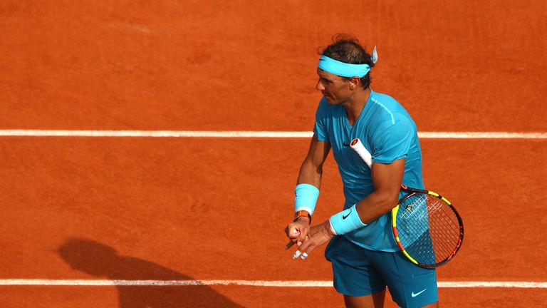 Rafael Nadal of Spain stretches off his fingers following an injury during the mens singles final against Dominic Thiem of Austria during day fifteen of the 2018 French Open at Roland Garros on June 10, 2018 in Paris, France.