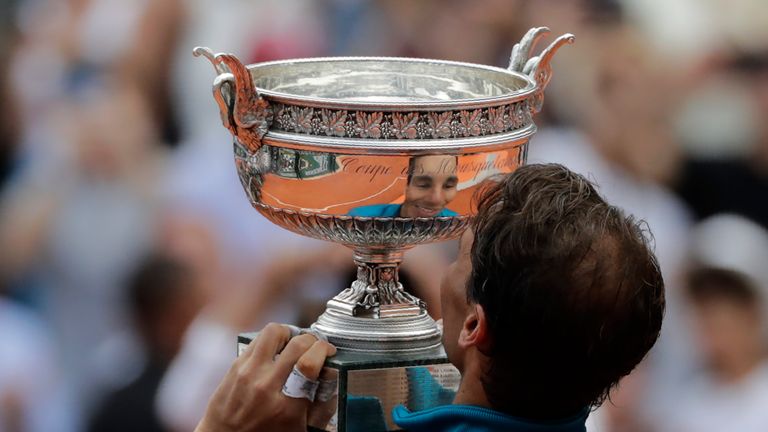 Spain's Rafael Nadal reacts as he poses with La Coupe des Mousquetaires - The Musketeers' Trophy after defeating Austria's Dominic Thiem in their men's singles final match on day fifteen of The Roland Garros 2018 French Open tennis tournament in Paris on June 10, 2018. 