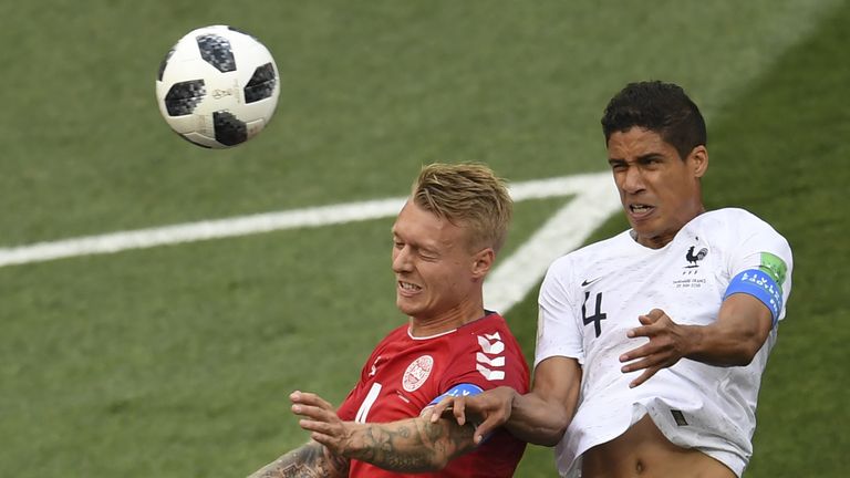 Raphael Varane and Simon Kjaer in action during the Group C match between Denmark and France in Moscow