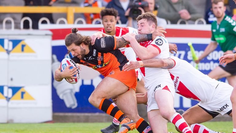 Castleford's Alex Foster fends off St Helens' Morgan Knowles