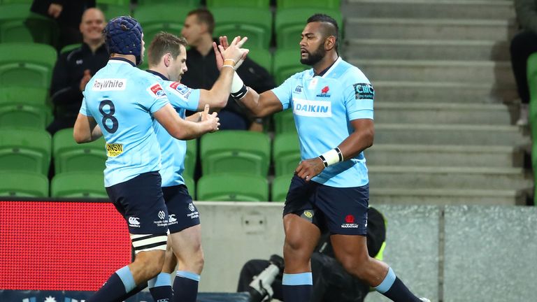 The Waratahs' Taqele Naiyaravoro is congratulated on his 12th try of the Super Rugby season