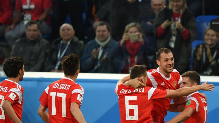 Russia's players celebrate after Egypt's defender Ahmed Fathi own goal