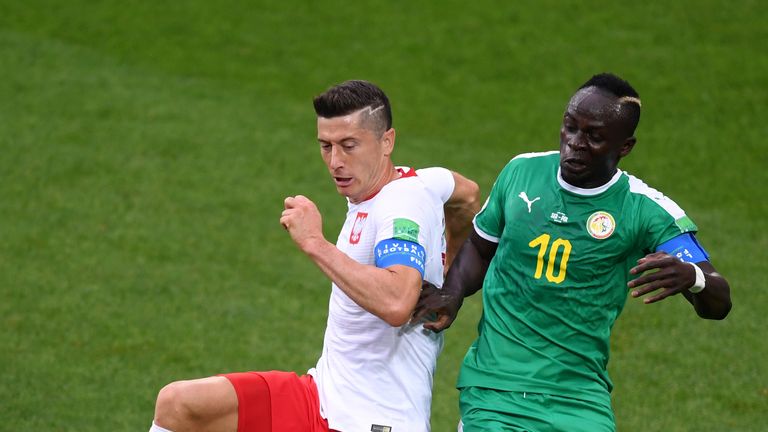 Sadio Mane and Robert Lewandowski battle for possession