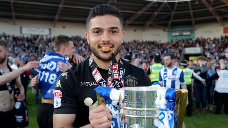 Wigan's Sam Morsy celebrate after Wigan win the sky Bet League One league at at the Keepmoat Stadium, Doncaster. PRESS ASSOCIATION Photo. Picture date: Saturday May 5, 2018. See PA story SOCCER Doncaster. Photo credit should read: Richard Sellers/PA Wire. RESTRICTIONS: EDITORIAL USE ONLY No use with unauthorised audio, video, data, fixture lists, club/league logos or "live" services. Online in-match use limited to 75 images, no video emulation. No use in betting, games or single club/league/player publications.