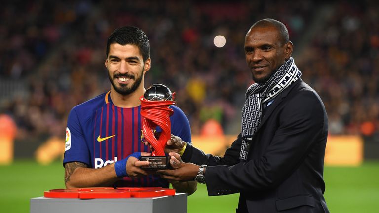 Abidal, pictured with current Barcelona forward Luis Suarez, won two Champions League titles with the club as a player