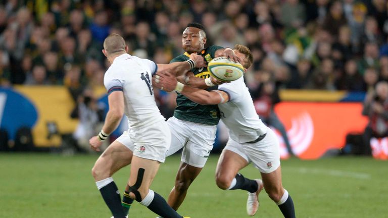S'busiso Nkosi looks to offload out of the tackle 