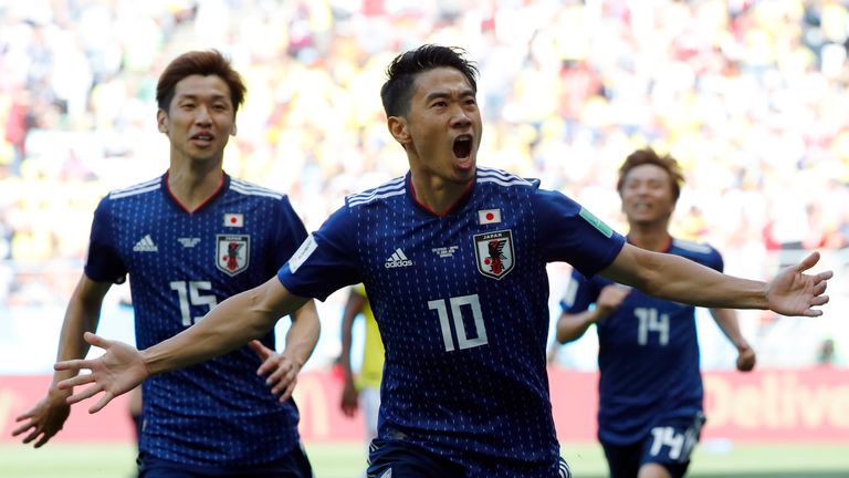 Japan's midfielder Shinji Kagawa celebrates scoring against Colombia
