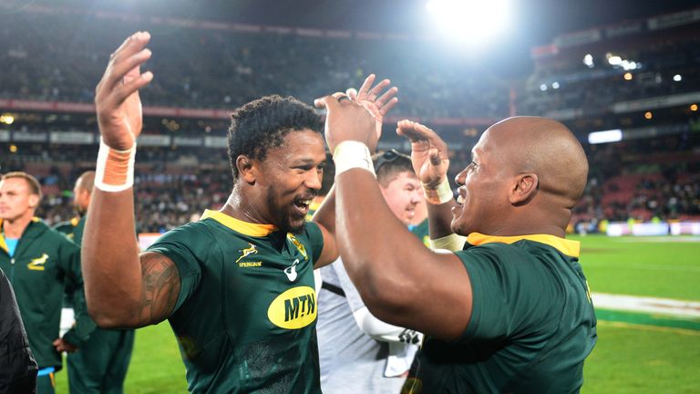 Sikhumbuzo Notshe (l) and Bongi Mbonambi (r) celebrate South Africa's victory over England in the first Test