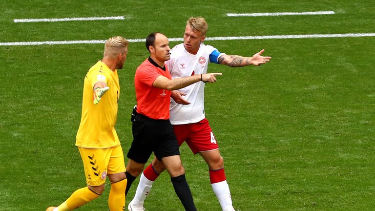 Simon Kjaer and Kasper Schmeichel dispute the decision to award Australia with a penalty
