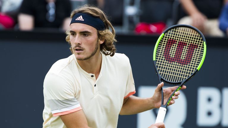 Greece's Stefanos Tsitsipas returns the ball to his Tunisia's Malek Jaziri during his men's singles tennis match at the Libema Open Tennis tournament in Rosmalen, on June 14, 2018. 