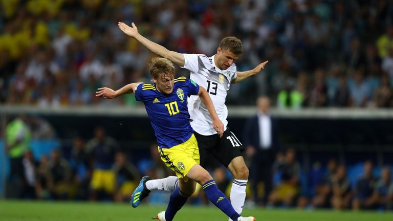 Thomas Muller challenges Emil Forsberg in the first half