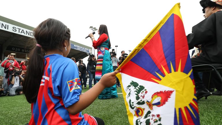 LONDON, ENGLAND - MAY 31: A Tibet fan watches a singer at the Opening Ceremony of the CONIFA World Football Cup 2018, Barawa v Tamil Eelam at Bromley on May 31, 2018 in London, England. (Photo by Con Chronis/CONIFA)