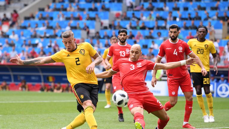 Toby Alderweireld shoots on goal under pressure Yohan Ben Alouane during the group G match between Belgium and Tunisia