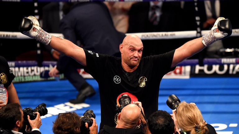 Tyson Fury celebrates after a comfortable win in his comeback fight