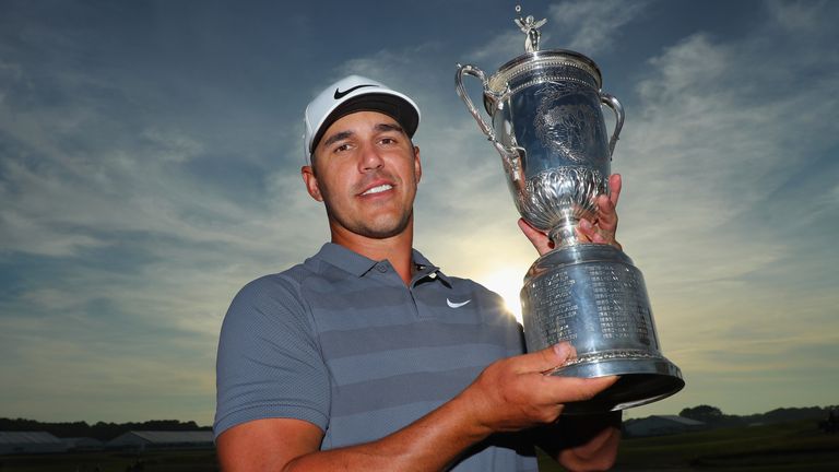 Brooks Koepka celebrates with the US Open trophy