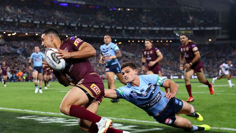 Holmes runs in the second try of the day for the Maroons in Sydney 