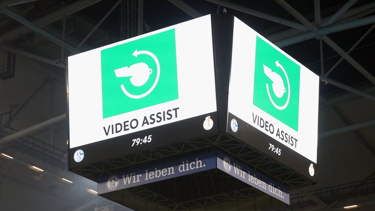 The sign for the VAR Video Assistant Referee is seen on the big screen during the DFB Cup Semi Final match between FC Schalke 04 and Eintracht Frankfurt in April
