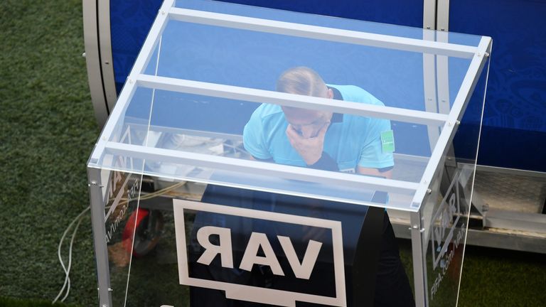 Referee Nestor Pitana reviews the VAR footage during the 2018 FIFA World Cup, group F match between Mexico and Sweden