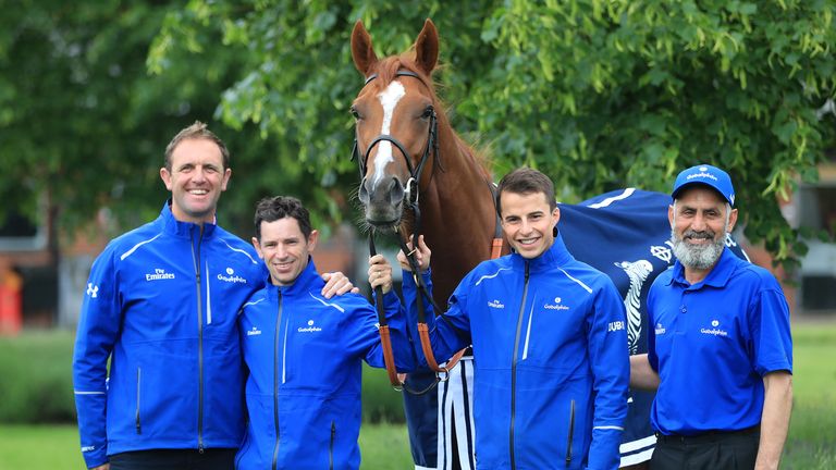 Trainer Charlie Appleby (left), day to day jockey Brett Doyle (centre left), winning jockey William Buick (centre right) and groom Saeed pose with Masar 