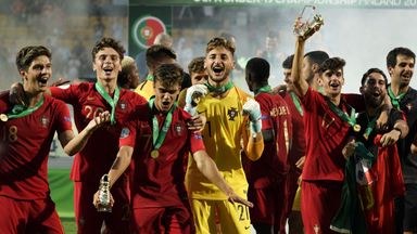 Portugal players, including Joao Filipe (C), celebrate winning the tournament